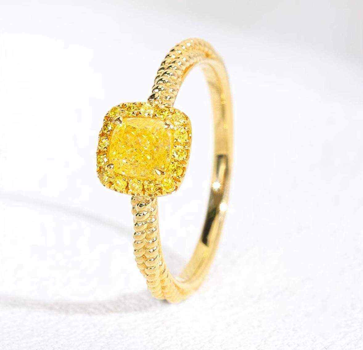18K yellow gold twisted ring with square yellow zircon gemstone and polished finish