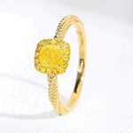 18K yellow gold twisted ring with square yellow zircon gemstone and polished finish