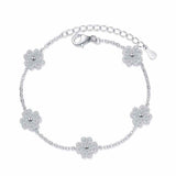 Adjustable 925 sterling silver bracelet with five colorless melee moissanite lucky clover freesia flower charms totaling 0.64 ct. tw. on a rolo chain