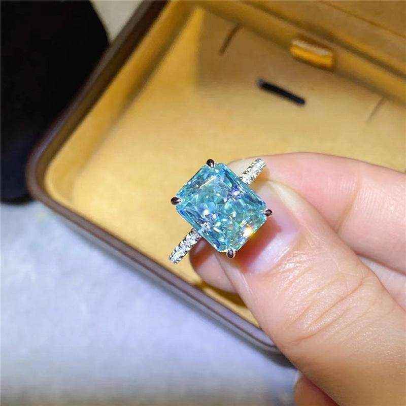 1.8 CTW DEW radiant cut blue green moissanite engagement ring in sterling silver pavé setting