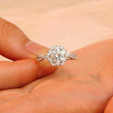 1 CTW DEW colorless round brilliant cut moissanite engagement ring with sterling silver twist pavé halo design