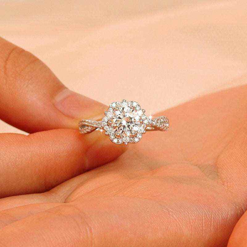 1 CTW DEW colorless round brilliant cut moissanite engagement ring with sterling silver twist pavé halo design