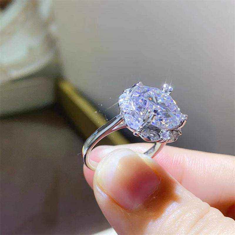 4.75 CTW DEW colorless round brilliant cut moissanite halo engagement ring in sterling silver