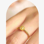 18K yellow gold cube sugar square gem dough twisted ring on finger with polished finish and zircon stone