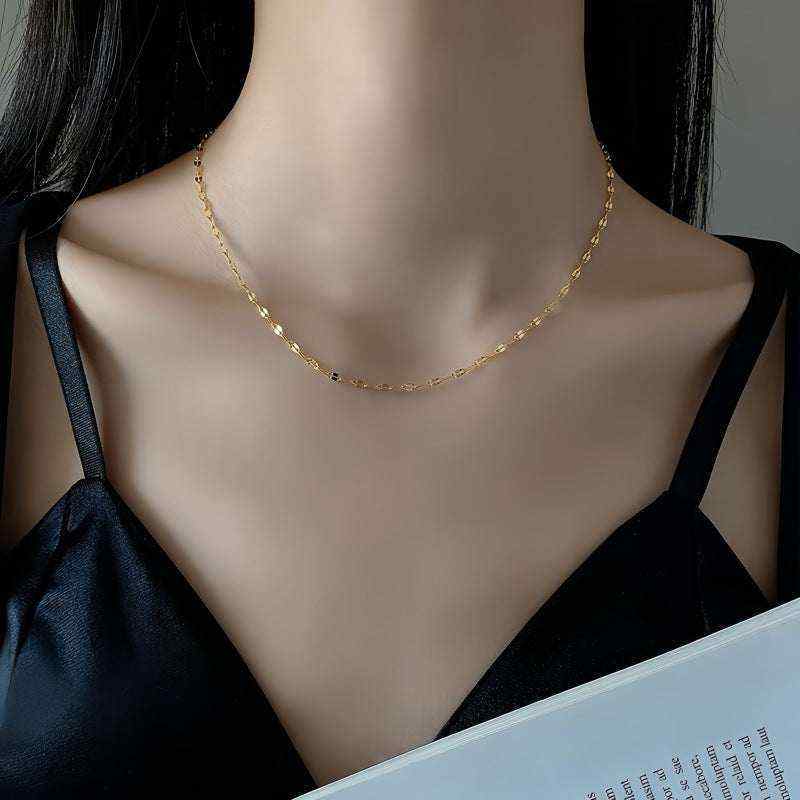 18K yellow gold keyhole lips link chain necklace worn on a woman's neck, minimalist and elegant design, 18-inch length