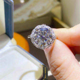 4.75 CTW DEW colorless round brilliant cut moissanite halo engagement ring in sterling silver