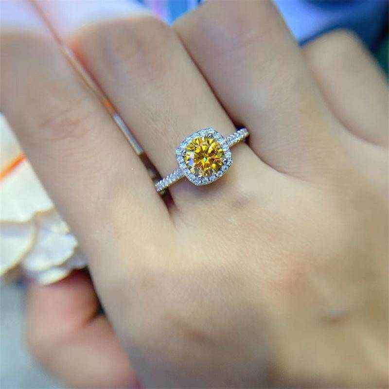 1 CTW DEW round brilliant cut yellow moissanite sterling silver cushion outline pavé halo engagement ring on hand