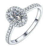 4.2 CTW DEW colorless oval brilliant cut moissanite engagement ring in sterling silver with pavé halo and braided design