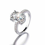 2.1 CTW DEW colorless oval moissanite engagement ring in sterling silver with pavé cubic zirconia accents