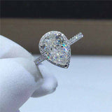 2.1 CTW DEW Colorless Pear Cut Moissanite Sterling Silver Outline Pavé