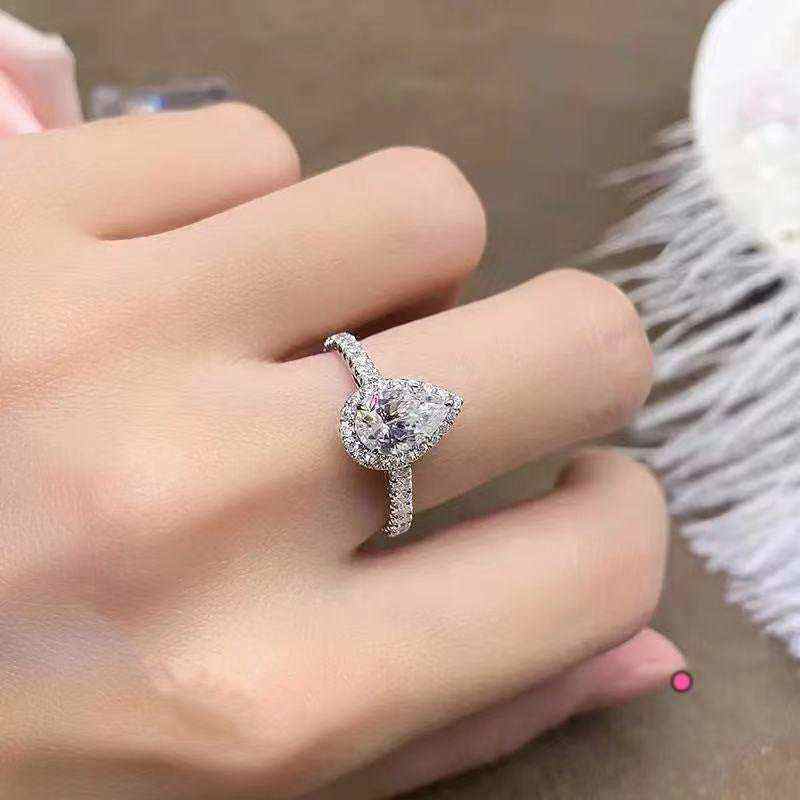 2.1 CTW DEW Colorless Pear Cut Moissanite Sterling Silver Outline Pavé