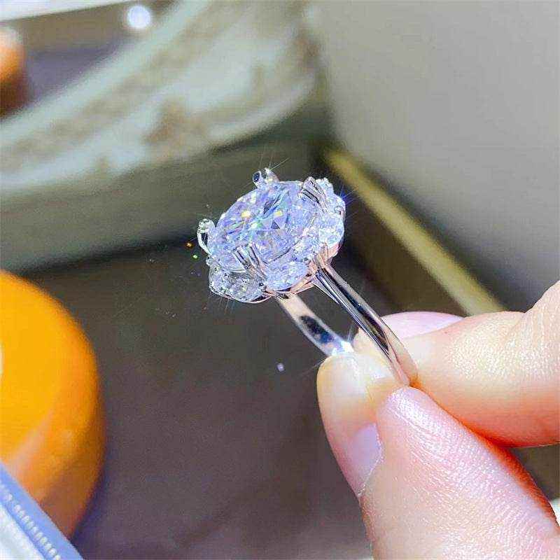 4.75 CTW DEW colorless round brilliant cut moissanite halo engagement ring in sterling silver