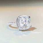 5 CTW colorless cushion cut moissanite halo engagement ring in sterling silver with pavé cubic zirconia accents