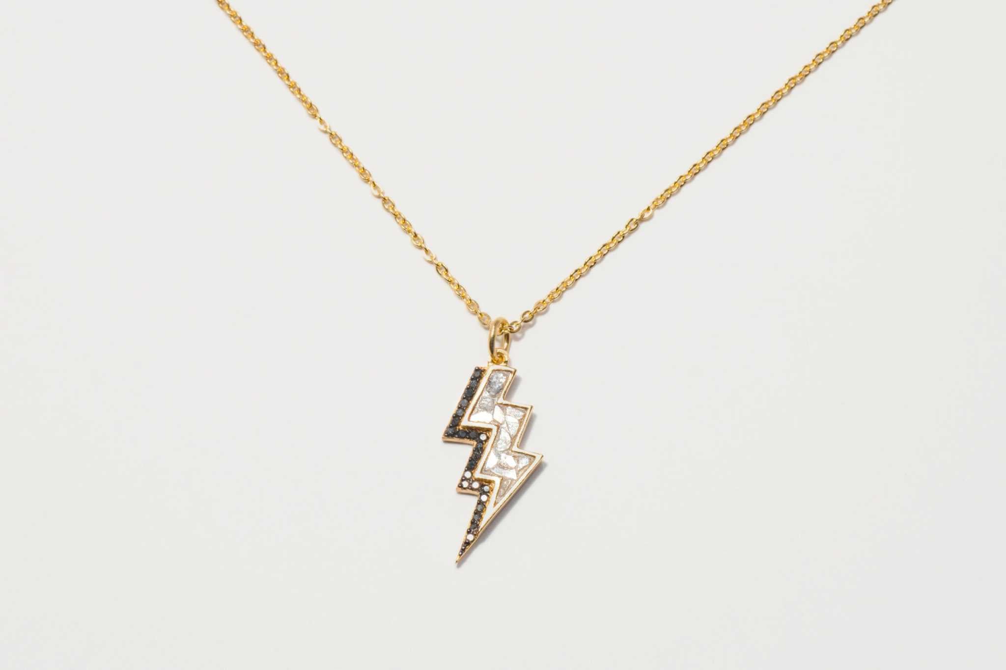 Gold vermeil Rishi Bolt Diamond lightning bolt pendant necklace with pavé and raw diamonds on a delicate chain