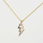 Gold vermeil Rishi Bolt Diamond lightning bolt pendant necklace with pavé and raw diamonds on a delicate chain