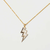 Gold vermeil Rishi Bolt Diamond lightning bolt pendant necklace with pavé and raw diamonds on a delicate chain