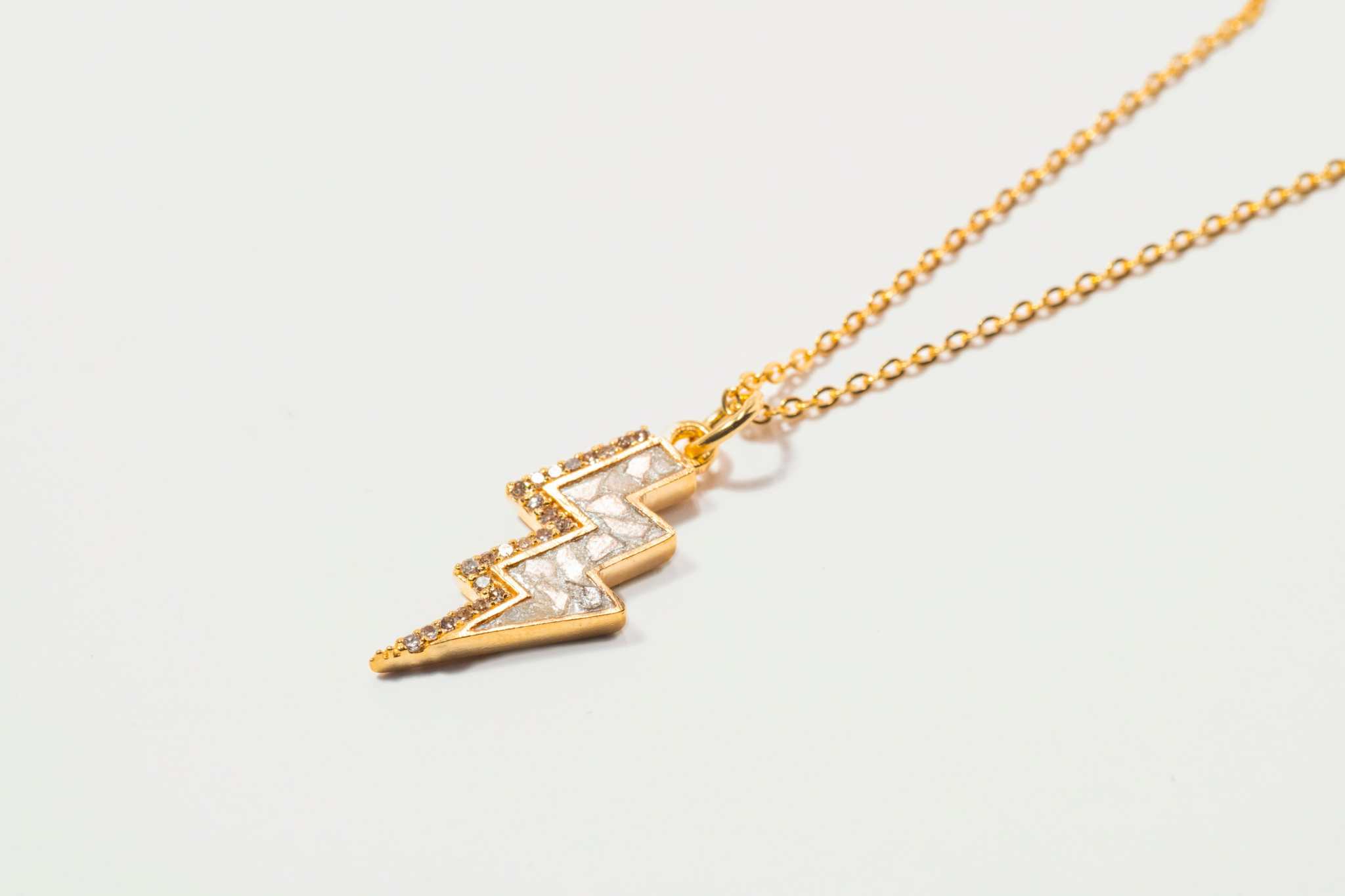 Rishi Bolt Diamond gold vermeil lightning bolt pendant necklace with raw and pave diamonds on delicate chain