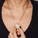 Scorpio Gold Vermeil Pendant Necklace with raw and rose cut diamonds on 18k gold vermeil chain worn on model's neck