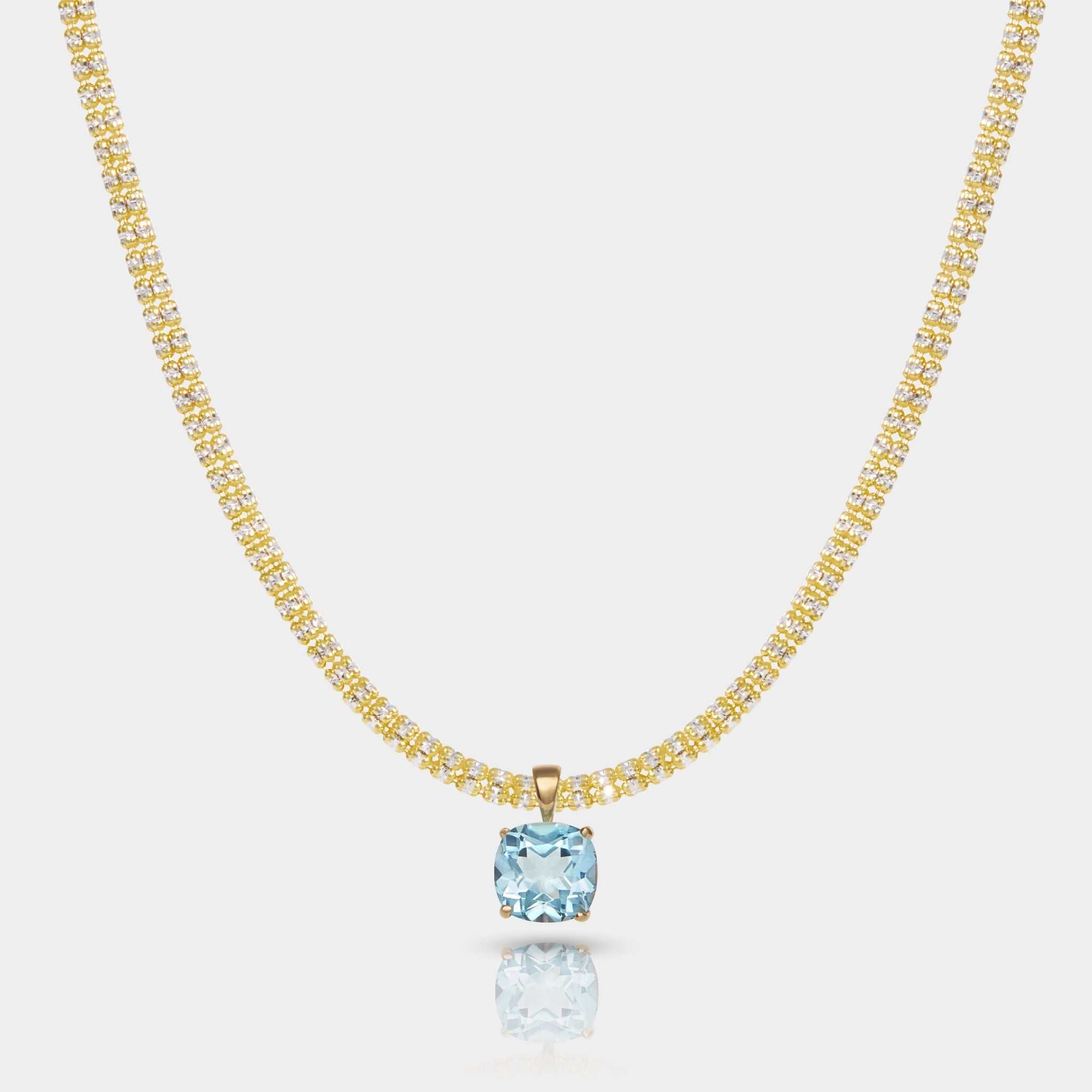 14k gold necklace with a sky blue topaz pendant featuring a square-cut gemstone in a gold basket setting