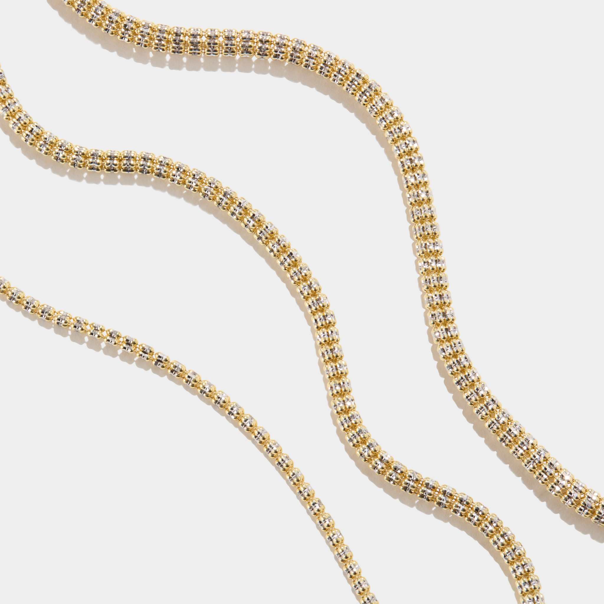 Tidal Tennis 14K Gold Bracelet with diamond-cut design in polished yellow gold on white background