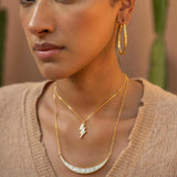 Woman wearing Thane Gold Vermeil Pendant Necklace with sliced raw diamonds and 18k gold chain