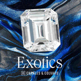 Charles & Colvard Forever One certified exotic emerald step cut moissanite gemstone on a blue and black marbled background