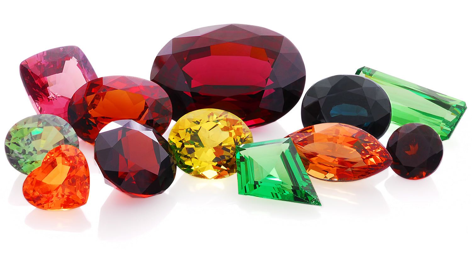 Assorted colorful garnet gemstones in various cuts representing January birthstones