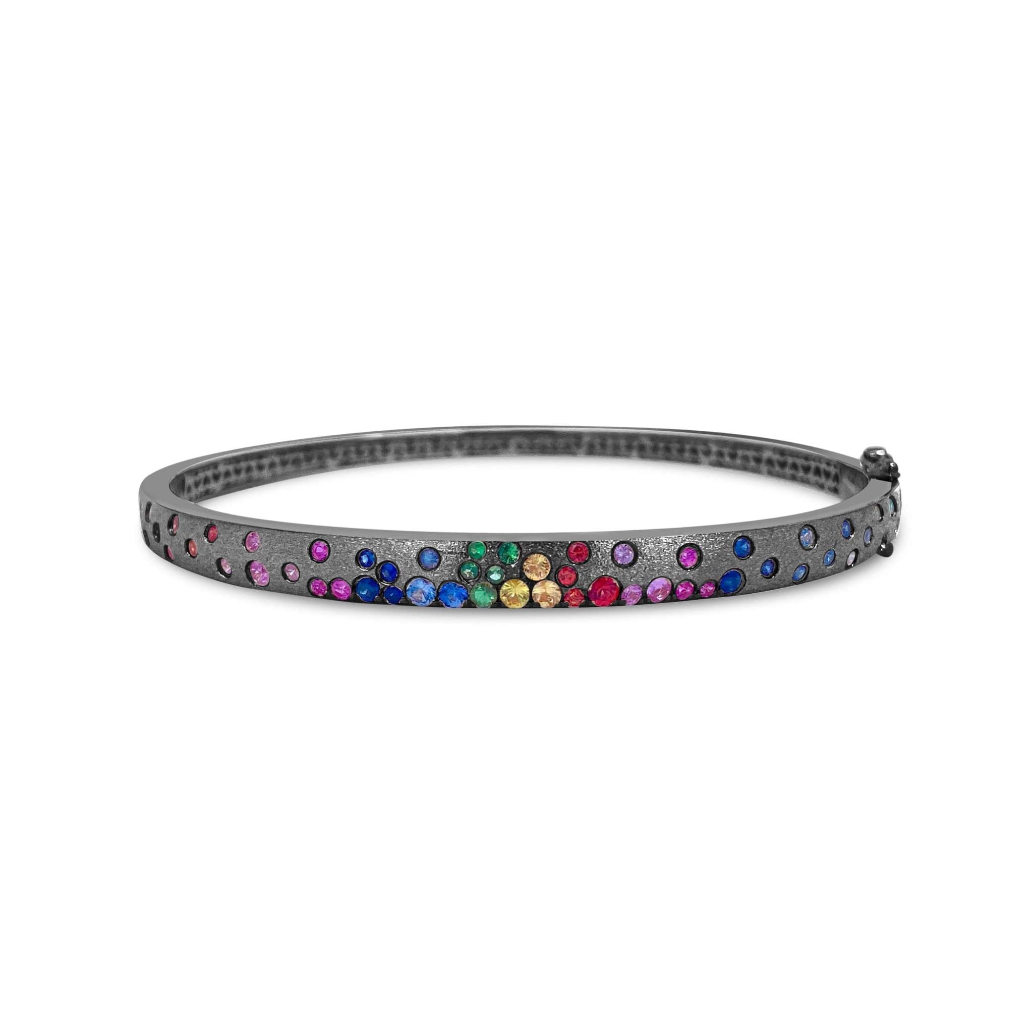 Sapphire Scattered Rainbow slim bangle in 14K gold with scattered multicolor sapphire gemstones and satin finish