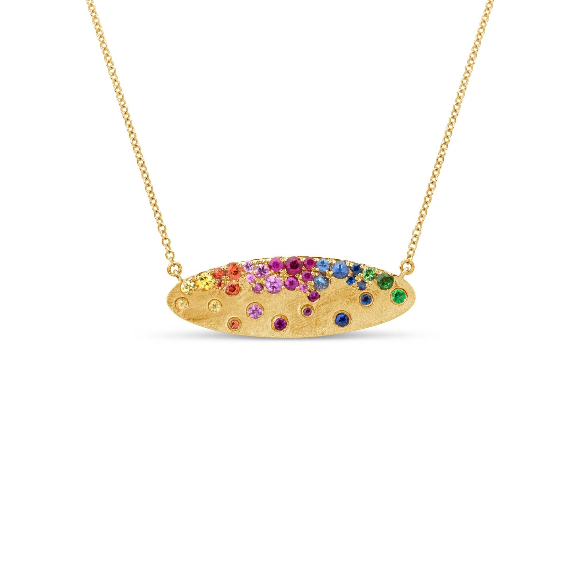 Scattered Rainbow Oval Pendant Necklace in 14k yellow gold with rainbow sapphires and tsavorites on a brushed satin finish and adjustable 18-inch chain