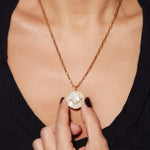 Aquarius Gold Vermeil pendant necklace with uncut and rose cut diamonds on a 18k gold vermeil chain worn on a woman's neck