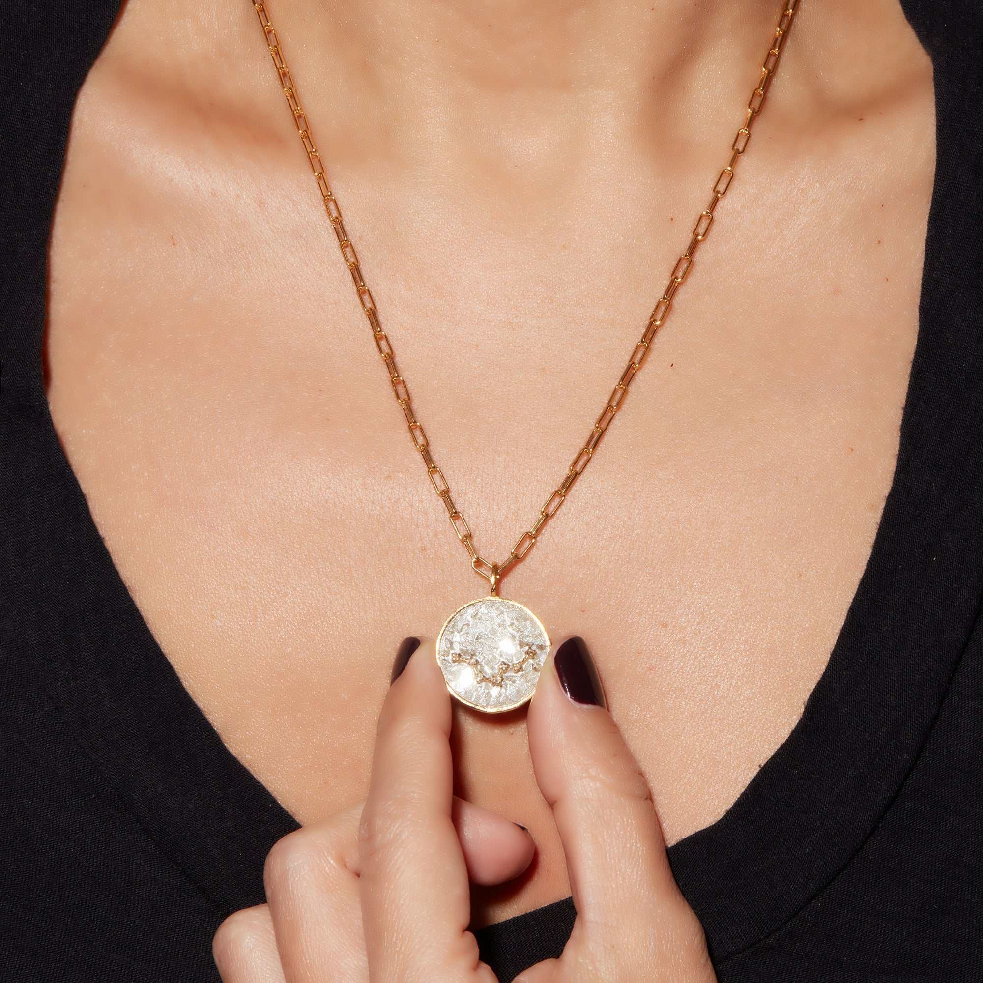 Aquarius Gold Vermeil pendant necklace with uncut and rose cut diamonds on a 18k gold vermeil chain worn on a woman's neck