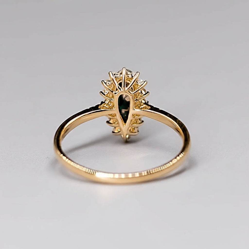 18K yellow gold engagement ring with Australian Black Opal and halo diamond setting