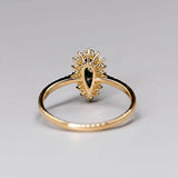 18K yellow gold engagement ring with Australian Black Opal and halo diamond setting