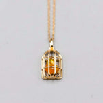 Bird Cage Mexican Fire Opal Necklace pendant in 14K yellow gold with orange opal stone