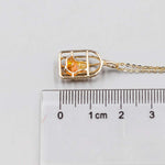 Bird cage Mexican fire opal necklace pendant in 14K yellow gold with 0.66 ct orange opal