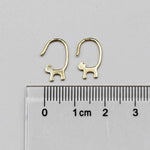 18k yellow gold cat tail hook earrings with drop style shown next to centimeter ruler for size reference