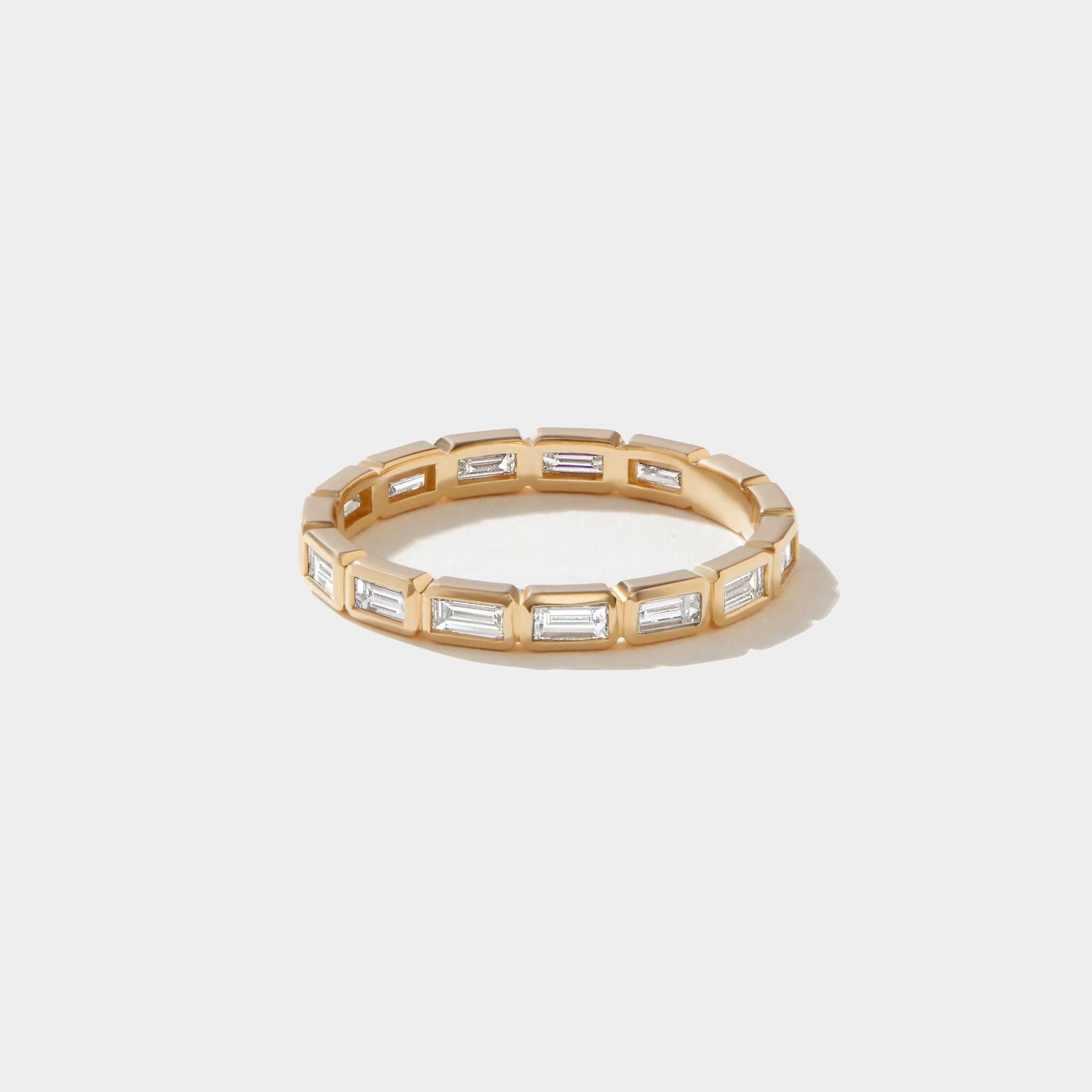 14k gold eternity band with east west bezel set lab-grown baguette diamonds totaling 1.52 carats