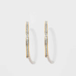 Pair of Hapur Gold Vermeil Hoop Earrings with textured silver resin and 18k gold edges.