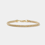 Tidal Tennis 14K gold bracelet with Italian design and diamond-cut sparkle, polished finish without diamonds.