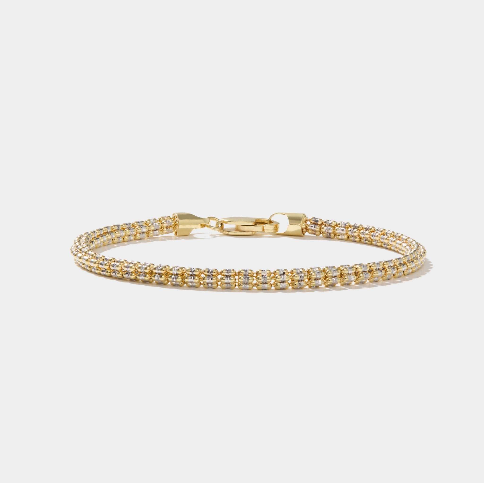 Tidal Tennis 14K gold bracelet with Italian design and diamond-cut sparkle, polished finish without diamonds.
