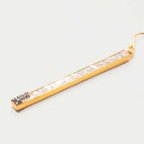 Long dangling Madeline Gold Vermeil earring with pave champagne diamonds and 18K gold layer