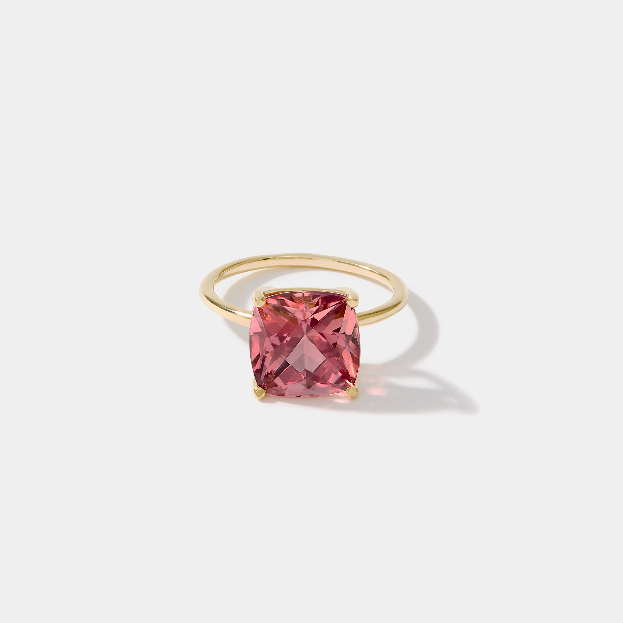 14k gold ring with cushion-cut Nantucket Red pink tourmaline gemstone on white background