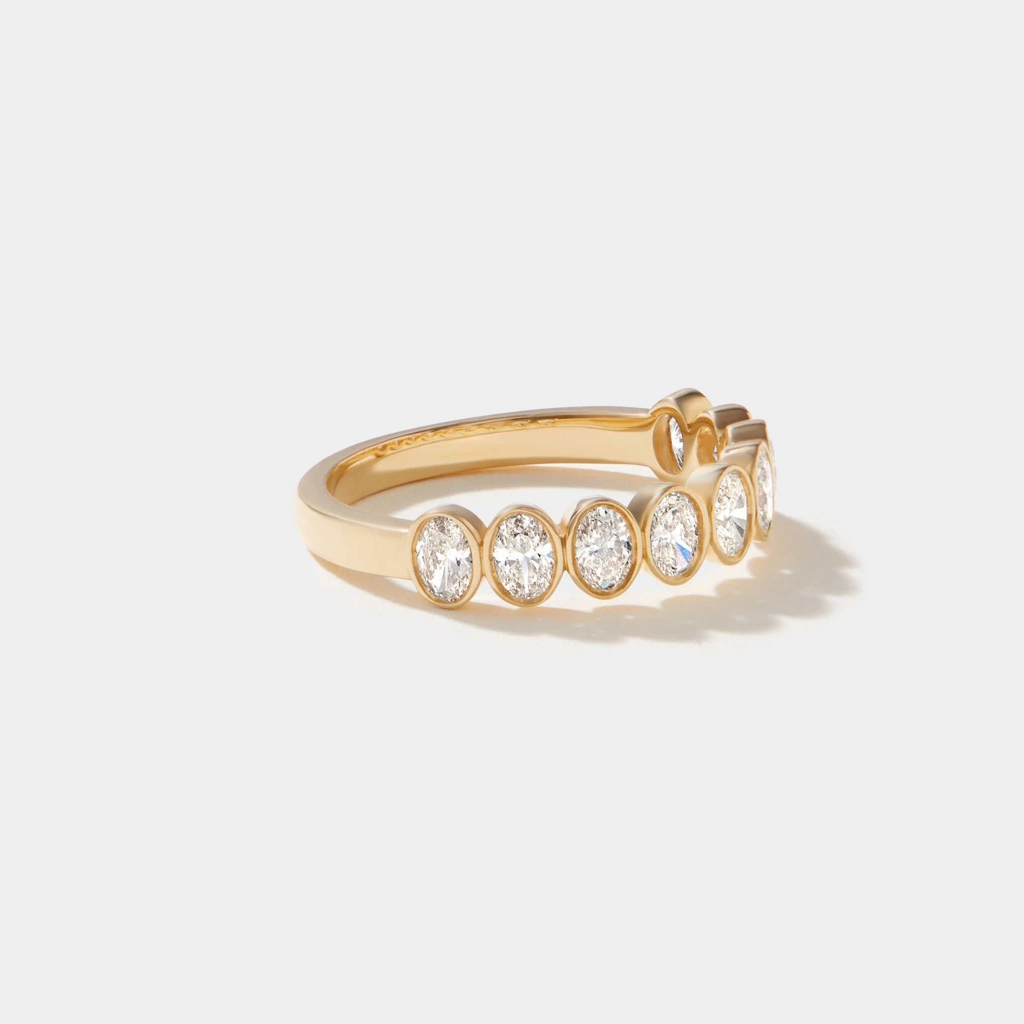 Highland Oval cut diamond bezel set half eternity ring in 14k solid gold