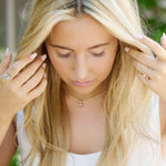 Woman wearing Horizon Nantucket Red pink tourmaline 14k gold necklace pendant with large bail and custom basket setting