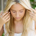 Woman wearing Connecticut Coast Morganite Ring with a 14k gold band and peach morganite gemstone