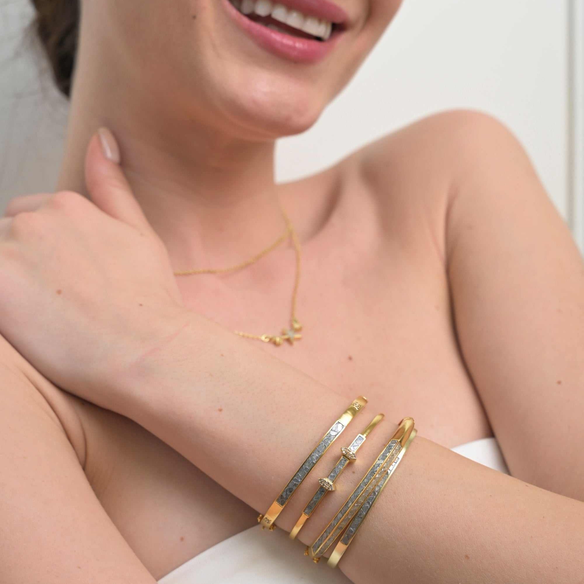 Sasta Gold Vermeil bangle bracelet with sliced raw diamonds and sterling silver base worn on wrist
