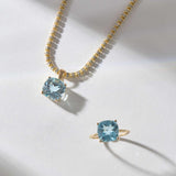 14k gold necklace and ring set featuring cushion cut sky light blue topaz gemstones