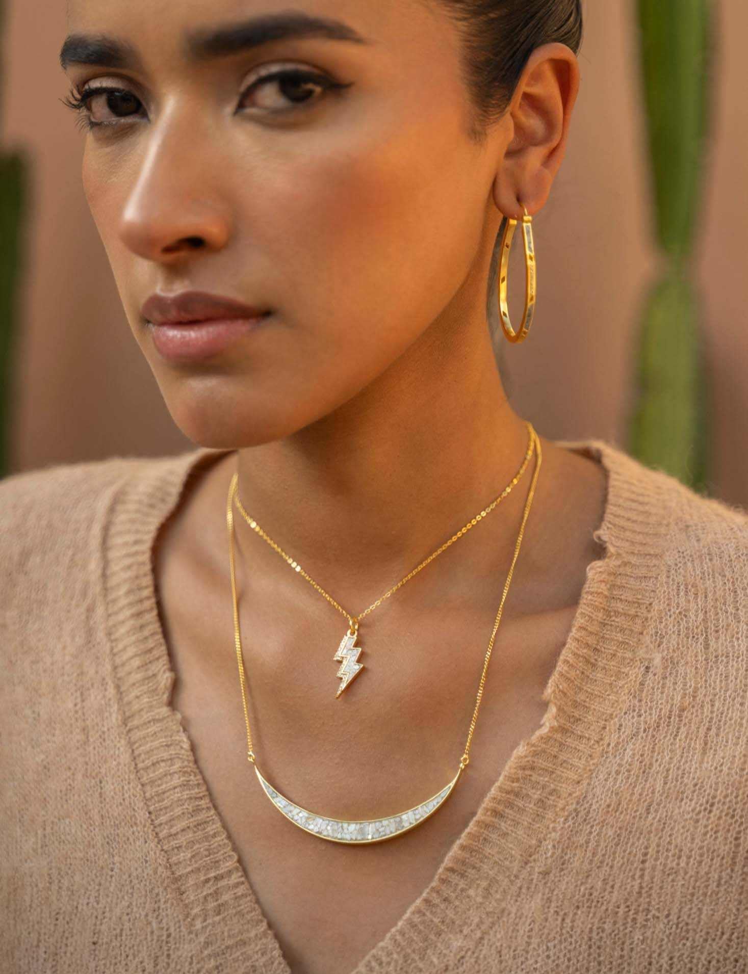 Woman wearing Thane Gold Vermeil Pendant Necklace with sliced raw diamonds and 18k gold chain