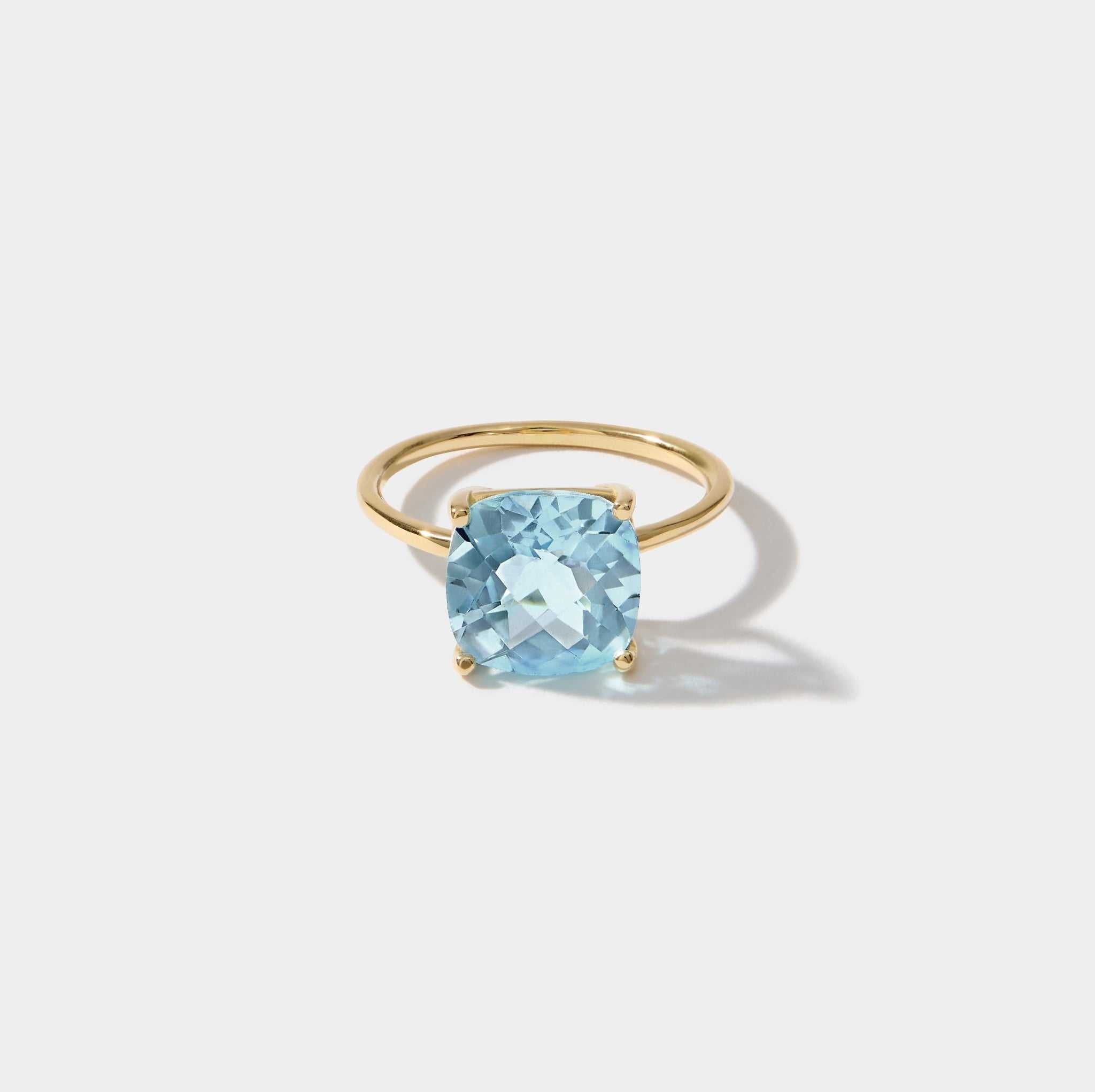 14k gold ring with cushion cut sky light blue topaz gemstone